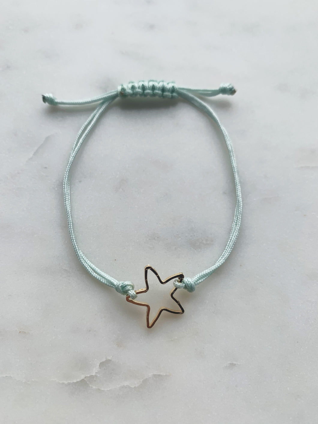 Hammered gold star pendant on adjustable rope (up to 8”)